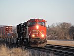 A CN southbound stack train rolls through farmland at Duplainville. March 26th, 2011