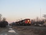A trio of veteran EMDs lead a northbound across the Duplainville diamond. March 28th. 2011