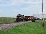 A widecab SD40-2 overtakes the waiting NS on the siding. May 19th, 2011
