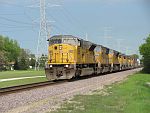 7 EMDs of all sizes move a UP mixed freight west in Sussex, WI. May 19th, 2011