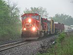 A CN northbound pushes on through heavy rain at Duplainville. May 21st, 2011